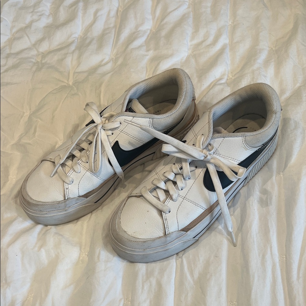 Nike White Low-Top Sneakers with Black Swoosh and Tan Trim
